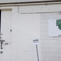 Ducks Powersports Repair - Sign and shop entrance