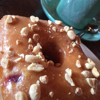 49th Parallel Coffee - The famous peanut butter jelly doughnut. The peanuts are fresh and crunchy, the jelly has a strong fruit (rather than sugar) flavor - Cafes Near Me - Vancouver, British Columbia