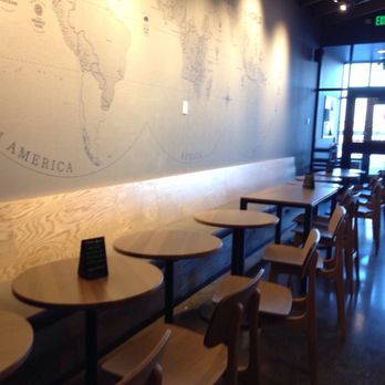 Starbucks - Seating area with "The three coffee growing regions of the world" mural on the wall. - Coffee & Tea Near Me - Homer Glen, Illinois Starbucks - Seating area with "The three coffee growing regions of the world" mural on the wall. - Coffee & Tea Near Me - Homer Glen, Illinois