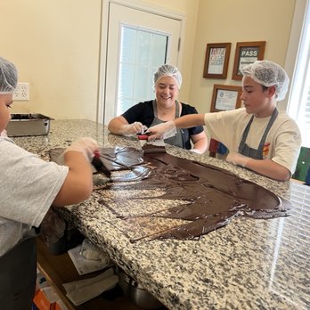 Wild Kauai Chocolate - Tempering chocolate, getting it ready to pour into our moulds - Chocolatiers & Shops Near Me - Kapaa, Hawaii Wild Kauai Chocolate - Tempering chocolate, getting it ready to pour into our moulds - Chocolatiers & Shops Near Me - Kapaa, Hawaii