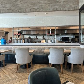 Wolfgang Puck Kitchen + Bar - Kitchen prep/cook area - New American Near Me - The Villages, Florida Wolfgang Puck Kitchen + Bar - Kitchen prep/cook area - New American Near Me - The Villages, Florida