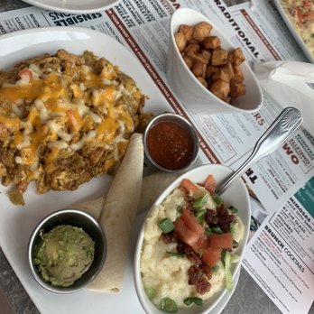 Another Broken Egg Cafe - Southwest scrambler with a side of city grits .I didn't really care for the scrambler but the city grits are always good . - Breakfast & Brunch Near Me - Fishers, Indiana