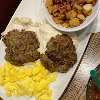 Another Broken Egg Cafe - Biscuits & Gravy dish with country potatoes w bacon - American Near Me - Austin, Texas Another Broken Egg Cafe - Biscuits & Gravy dish with country potatoes w bacon - American Near Me - Austin, Texas