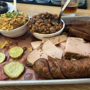 Cornbred - From 12 o'clock:  Beans, pork sparerib, turkey, sausage link, hallelujah potatoes. - Barbeque Near Me - Ames, Iowa