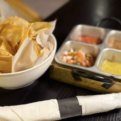 Chips and salsas at the table- chips were fresh!