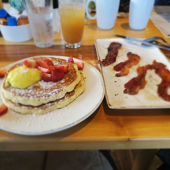 First Watch - Iced chai cider, lemon ricotta pancakes and million dollar bacon. - Breakfast & Brunch Near Me - North Miami Beach, Florida First Watch - Iced chai cider, lemon ricotta pancakes and million dollar bacon. - Breakfast & Brunch Near Me - North Miami Beach, Florida