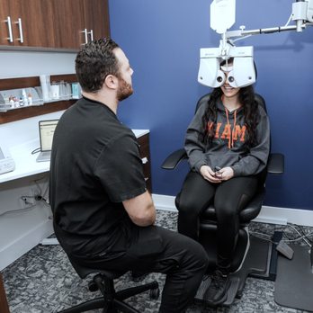 Beck Eyecare - Dr. Kashat performing the eyeglass prescription test using a digital brand-new machine - Optometrists Near Me - Novi, Michigan