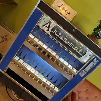 The Mod Olive - Old timey cigarette machine - New American Near Me - Suffolk, Virginia