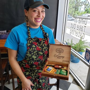 La Bodega Original - Chef Cely holding box of Assorted Teas (available upon request) - Latin American Near Me - Jacksonville, Florida