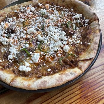 Odd Duck - Braised goat pizza, pecan mole, Oaxaca, chevre, jalapeño, cilantro, 23. - American Near Me - Austin, Texas
