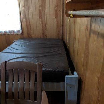 Holiday Trav-L Park - Better view of bed in AC cabin - Campgrounds Near Me - Virginia Beach, Virginia