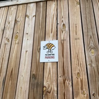 Pig Candy BBQ - a sign on a wooden fence - Barbeque Near Me - Cincinnati, Ohio