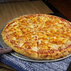 Stars and Strikes - Our signature sauce covered with mozzarella, cheddar, jack, and parmesan cheese