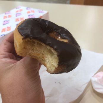Baskin-Robbins - a hand holding a half eaten doughnut - Ice Cream & Frozen Yogurt Near Me - Brandon, Florida