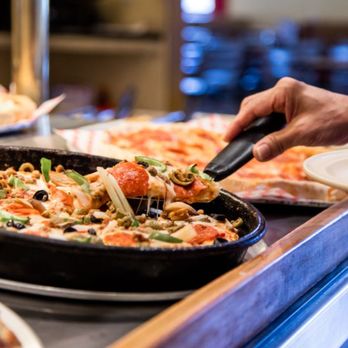 Pizza Inn - a pan of pizza being served - Pizza Near Me - Sikeston, Missouri Pizza Inn - a pan of pizza being served - Pizza Near Me - Sikeston, Missouri