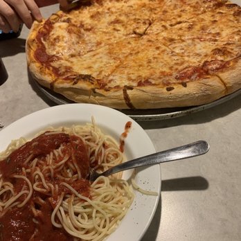 The Wagon Wheel Pizza - a plate of spaghetti and a pizza - Pizza Near Me - Melbourne, Florida The Wagon Wheel Pizza - a plate of spaghetti and a pizza - Pizza Near Me - Melbourne, Florida