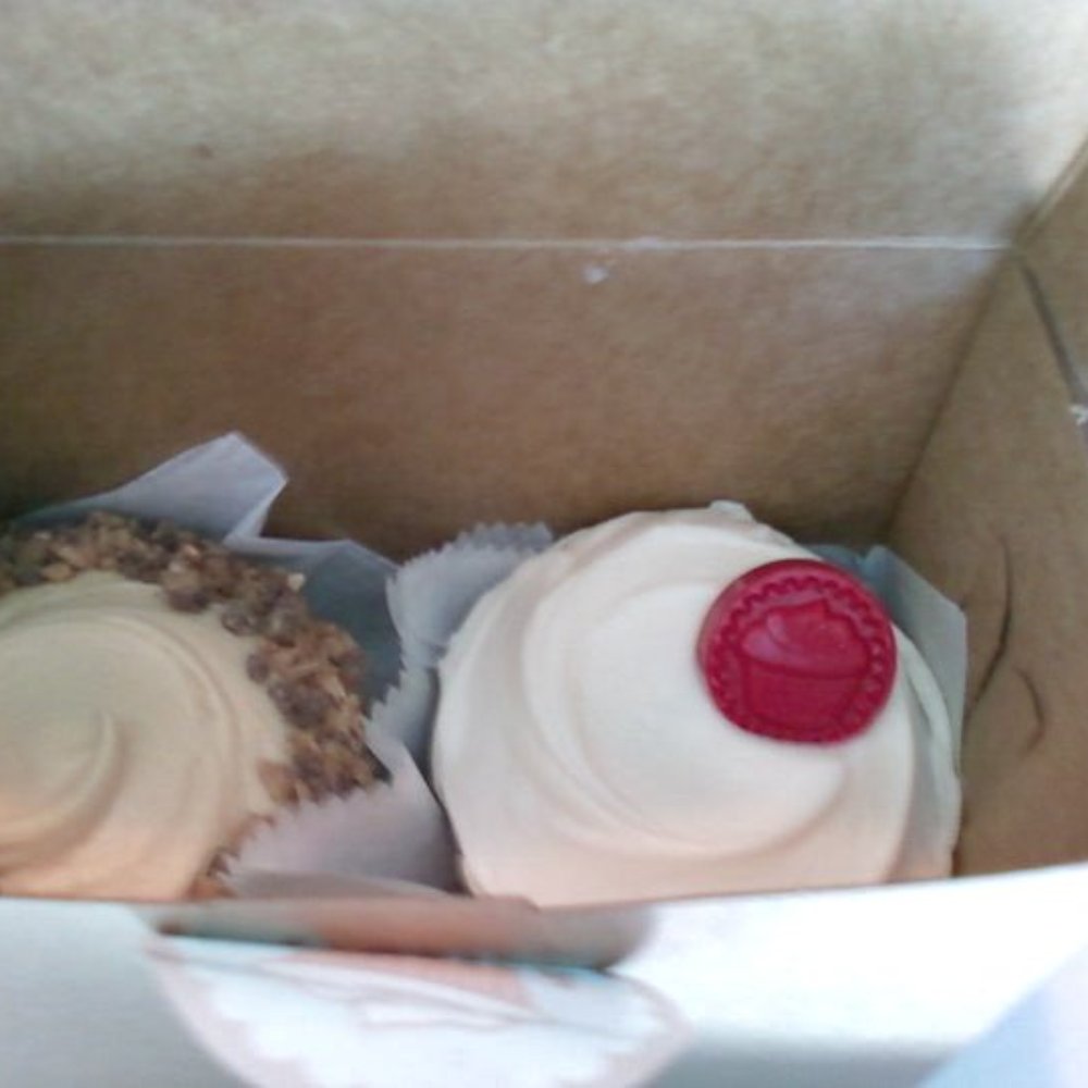 Frosted Cupcakery - chocolate cupcake with caramel buttercream toffee and the classic red velvet on the right. SO GOOD! - Bakeries Near Me - Long Beach, California Frosted Cupcakery - chocolate cupcake with caramel buttercream toffee and the classic red velvet on the right. SO GOOD! - Bakeries Near Me - Long Beach, California