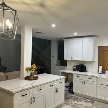 Dyna-Cap Builders - a kitchen with a center island - Electricians Near Me - Anaheim, California