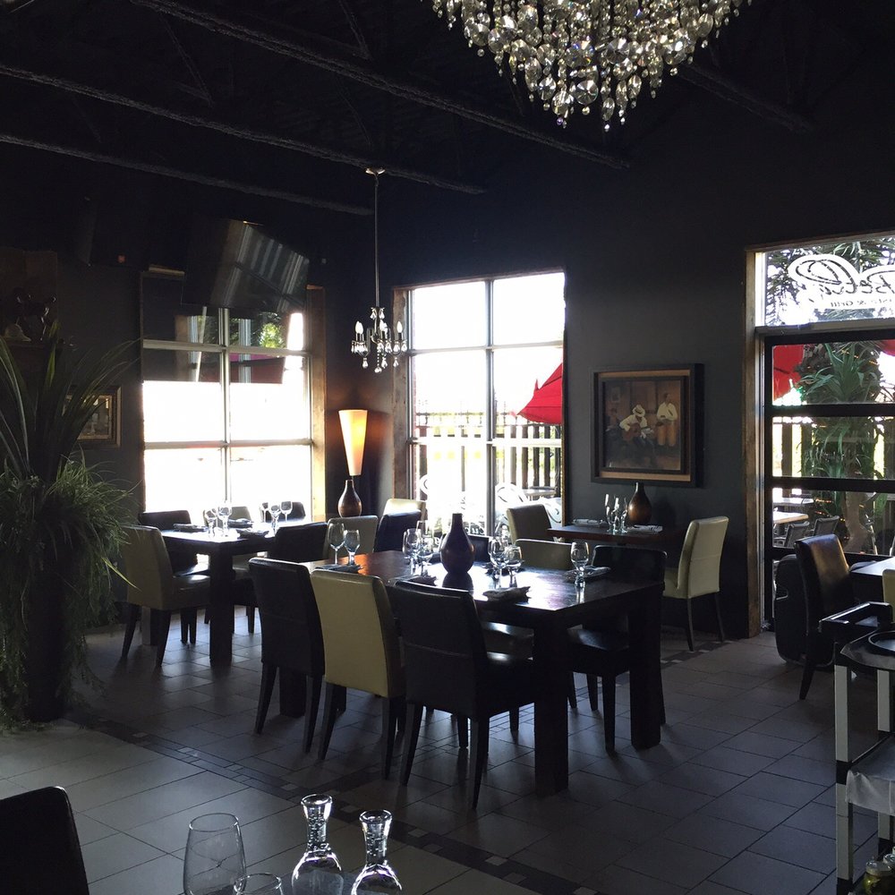 Isola Bella - a dining room with a chandelier - Italian Near Me - Terrebonne, Quebec Isola Bella - a dining room with a chandelier - Italian Near Me - Terrebonne, Quebec