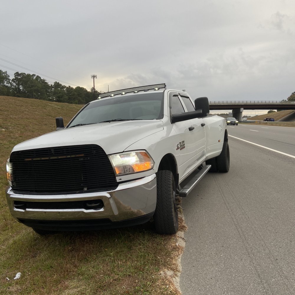 Quick Tripp Roadside Assistance - Owner PJ arrived in this white Ram truck. I-295 north just before exits 21 A-B-C in Fayetteville, NC. - Towing Near Me Quick Tripp Roadside Assistance - Owner PJ arrived in this white Ram truck. I-295 north just before exits 21 A-B-C in Fayetteville, NC. - Towing Near Me