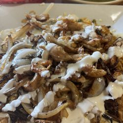 Margarita's Family Mexican Restaurant - Dinner Entree ACP - Arroz con Pollo with Grilled Onions and Sour Cream added.