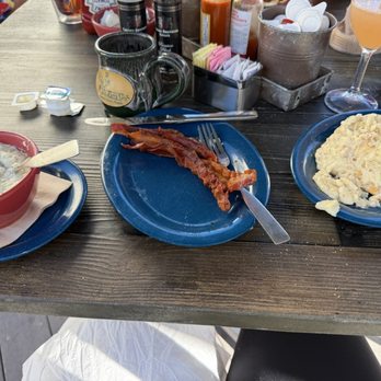 Over Easy Cafe - Grits, bacon and a gravy stripped biscuit, LOL. The gravy was great, this biscuit was not edible, IMHO!! - Breakfast & Brunch Near Me - Sanibel, Florida Over Easy Cafe - Grits, bacon and a gravy stripped biscuit, LOL. The gravy was great, this biscuit was not edible, IMHO!! - Breakfast & Brunch Near Me - Sanibel, Florida