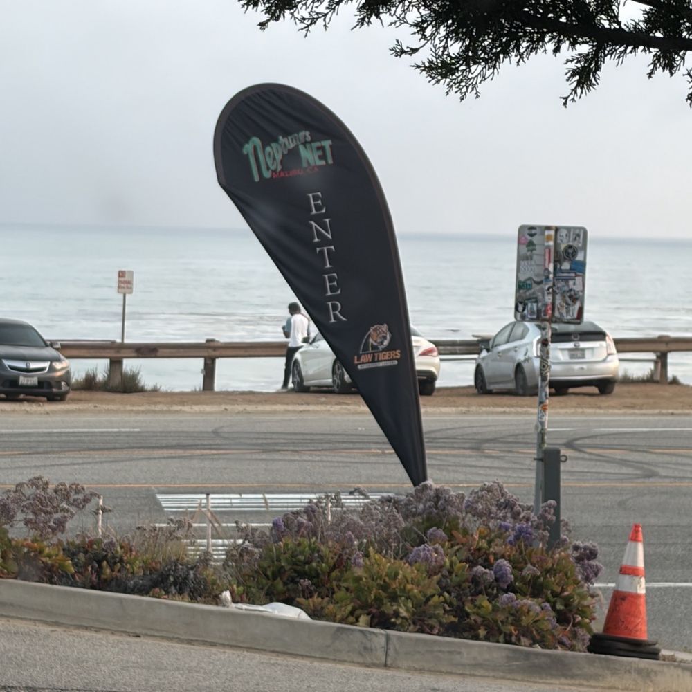 Neptune's Net - Parking lot entrance sign - Seafood Near Me - Malibu, California Neptune's Net - Parking lot entrance sign - Seafood Near Me - Malibu, California
