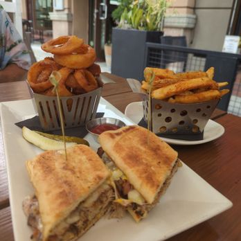 The Corner Drafthouse - Cubano sandwich with onion rings and extra fries. - Gastropubs Near Me - San Diego, California The Corner Drafthouse - Cubano sandwich with onion rings and extra fries. - Gastropubs Near Me - San Diego, California
