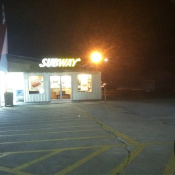 Subway - a car parked in a parking lot at night - Sandwiches Near Me - Carlyle, Illinois