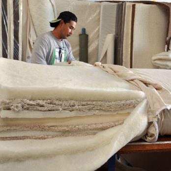Nicks Got Your Back - Miguel showing off the inside of a raw organic mattress prior to being upholstered. - Mattresses Near Me - Culver City, California Nicks Got Your Back - Miguel showing off the inside of a raw organic mattress prior to being upholstered. - Mattresses Near Me - Culver City, California