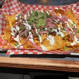 Happy hour pulled pork nachos