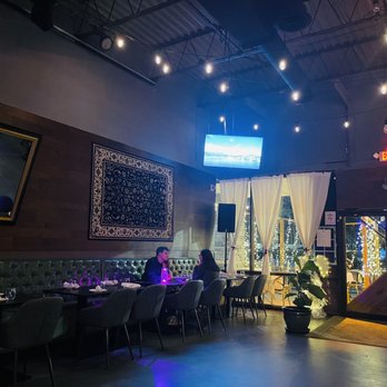 Farsi Kitchen - A carpet on the wall to have a hint of the Mediterranean menu represented - Persian/Iranian Near Me - Atlanta, Georgia
