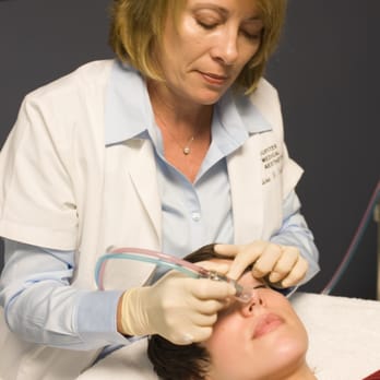 Jupiter Medical Aesthetics - Denise performing a microdermabrasion. - Skin Care Near Me - Plainfield Charter Township, Michigan Jupiter Medical Aesthetics - Denise performing a microdermabrasion. - Skin Care Near Me - Plainfield Charter Township, Michigan