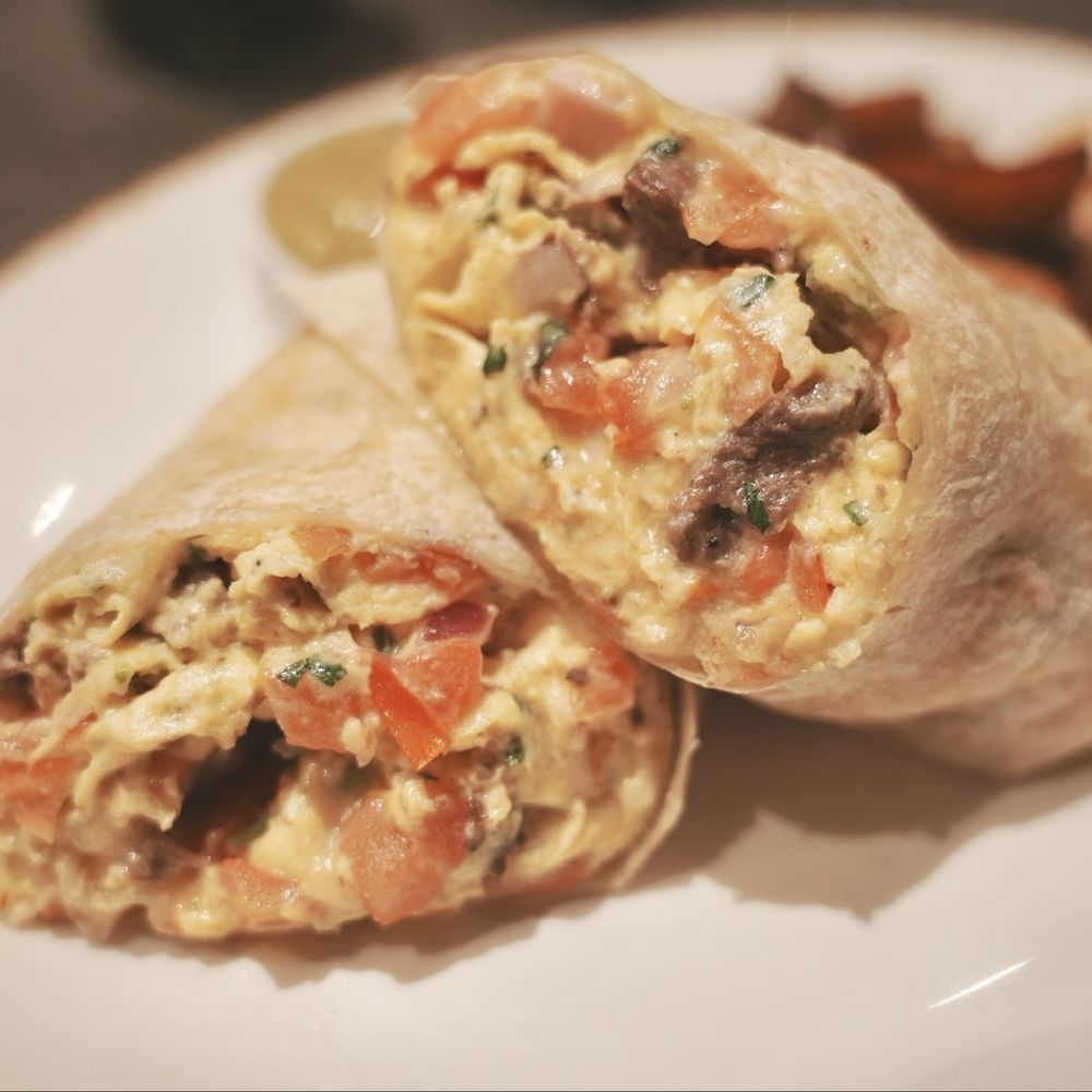 Serrano Vista Cafe - Asada Breakfast Burrito. Tender, marinated asada wrapped in a soft tortilla with just the right amount of eggs and cheese. - Cafes Near Me - S Highland, California Serrano Vista Cafe - Asada Breakfast Burrito. Tender, marinated asada wrapped in a soft tortilla with just the right amount of eggs and cheese. - Cafes Near Me - S Highland, California