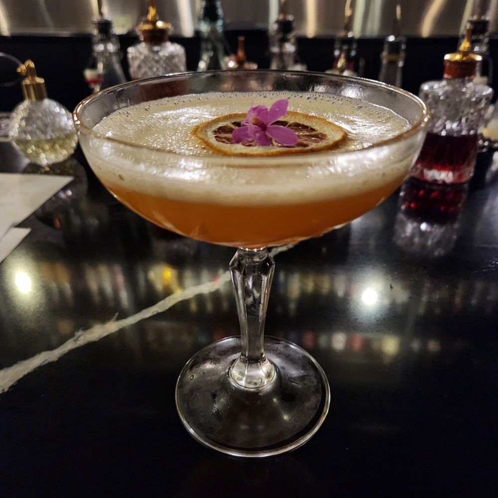The Beautiful Little Fool (vodka, aperol, passionfruit, lemon, soda water.)