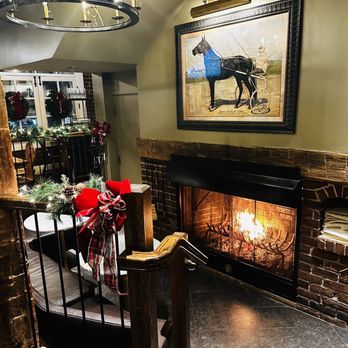The Tavern - a fireplace with a horse in the background - Bars Near Me - State College, Pennsylvania The Tavern - a fireplace with a horse in the background - Bars Near Me - State College, Pennsylvania