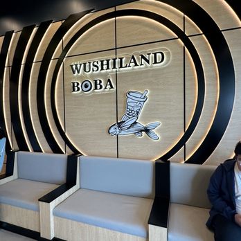 Wushiland Boba Katy - a man sitting on a couch - Bubble Tea Near Me - Katy, Texas
