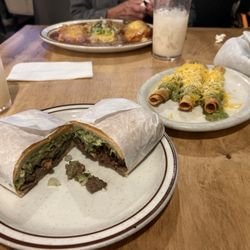 Chile Riano plate in the background, torta and roll tacos in the front