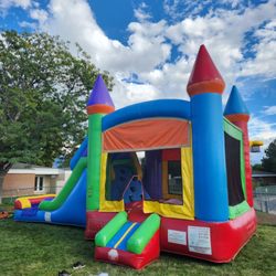 Get Your Bounce On - Our Rainbow Castle wet/dry bounce & slide combo is very popular.