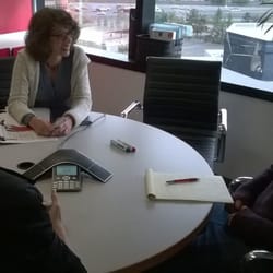 Meeting with three students in a conference room.