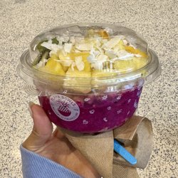 Electric Mermaid (Playa Pitaya topped with blueberry flax granola, pineapple, mango, kiwi, coconut flakes, and honey)