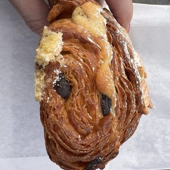 Sarmentine - Organic French Bakery - a person holding a pastry - Bakeries Near Me - Sebastopol, California Sarmentine - Organic French Bakery - a person holding a pastry - Bakeries Near Me - Sebastopol, California