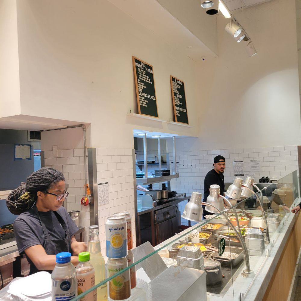 a man and a woman preparing food in a kitchen a man and a woman preparing food in a kitchen