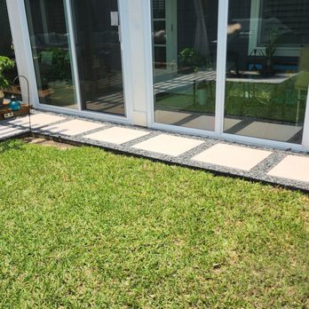 Next View Landscaping Services - Backyard path in front of sunroom and deck - Landscaping Near Me