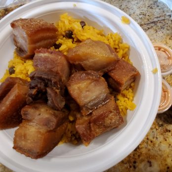 Punta Cana Dominican Grill - Yellow rice with fried pork belly - Dominican Near Me - Westbury, New York Punta Cana Dominican Grill - Yellow rice with fried pork belly - Dominican Near Me - Westbury, New York