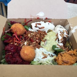 Smorl's Houmous Falafel & Salad Bar - The lunchbox with Falafel, salads, sauces, seeds and Polenta Parmesan balls! Delicious!