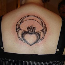 Irezumi Tattoo Studio - Rough idea for right arm between wrist and elbow not the ring  the hands love heart and a bible instead of crown