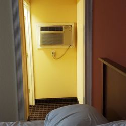 Starlite Motel - A/C unit is tucked in the small hall to the bathroom