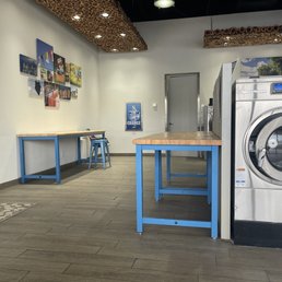 Side nook with washers, dryers, & folding space. Side nook with washers, dryers, & folding space.