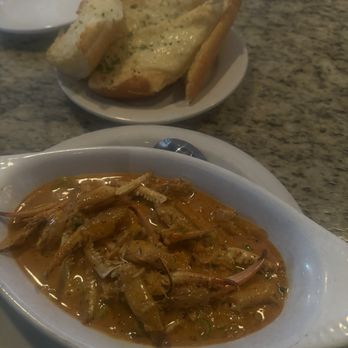 Eugene’s Gulf Coast Cuisine - Crab Fingers with Garlic Parmesan Bread - Steakhouses Near Me - Houston, Texas Eugene’s Gulf Coast Cuisine - Crab Fingers with Garlic Parmesan Bread - Steakhouses Near Me - Houston, Texas